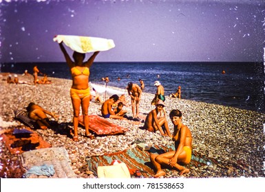 USSR, ABKHAZIA, LESELIDZE VILLAGE - CIRCA 1983: Vintage Photo Of Family Beach Scene On Black Sea