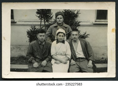 USSR - CIRCA 1940s: An Antique Photo Show Three Soldiers And A Nurse, Period Of WWII