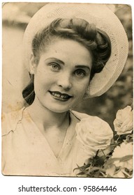 USSR - CIRCA 1947: Portrait Of A Young Beautiful Woman With White Roses, Circa 1947