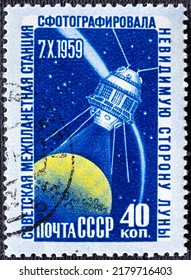 USSR - CIRCA 1959: A Post Stamp Printed In USSR Showing Moon And Spy Satellite Devoted Space Exploration.