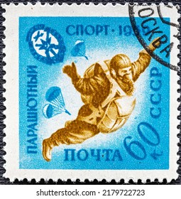 USSR - CIRCA 1959: Stamp Printed In USSR Russia Shows Parachutist In Sky, Free Fall, Series Voluntary Society Of The Assistance To Army.