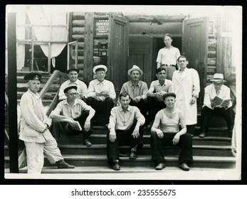 Ussr - CIRCA 1960s: An Antique Black & White Photo Show A Group Of Men On The Porch Of The Hospital