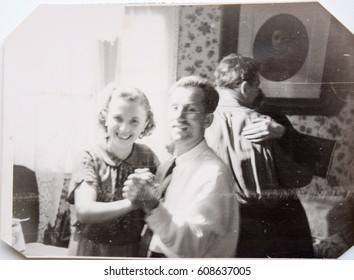 USSR, LENINGRAD - CIRCA 1952: Vintage photo of smiling young couple dancing, Victor and Valentina Ilyin