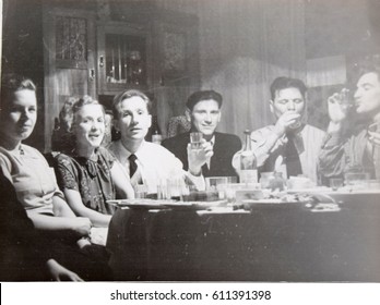 USSR, LENINGRAD - CIRCA 1952: Vintage Family Photo Of Feast Of Young Friends