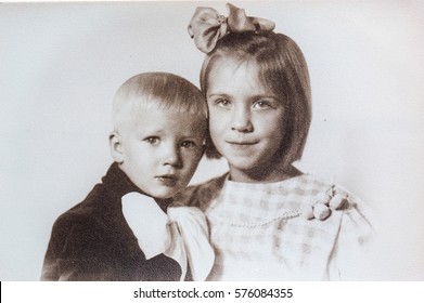 USSR, LENINGRAD - CIRCA 1958: Vintage photo of little sister and brother in Leningrad, USSR