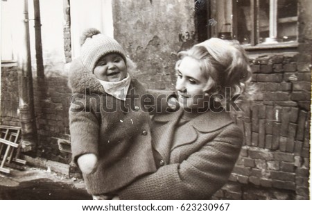 USSR, LENINGRAD - CIRCA 1970: Vintage photo of happy young mom with baby girl daughter