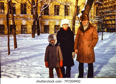 USSR, LENINGRAD - CIRCA 1981: Vintage Photo Of Soviet Family: Father With Children On Winter Walk