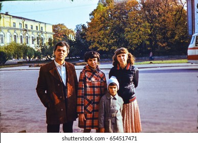 USSR, LENINGRAD - CIRCA 1982: Vintage Photo Of Soviet Family On Walk In Autumn