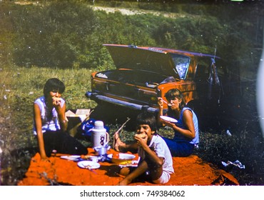 USSR, LENINGRAD - CIRCA 1983: Vintage Photo Of Family Car Trip Vacation Picnic Scene