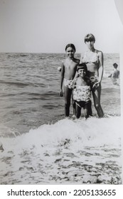 USSR, SOCHI - CIRCA 1979: Vintage Family Photo Of Mother With Children On The Black Sea Beach