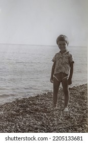 USSR, SOCHI - CIRCA 1979: Vintage Family Photo Of Boy On The Black Sea Beach