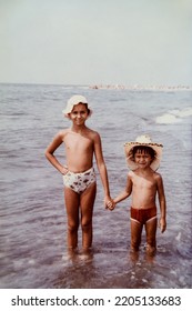 USSR, SOCHI - CIRCA 1979: Vintage Family Photo Of Little Sister And Brother On The Black Sea Beach