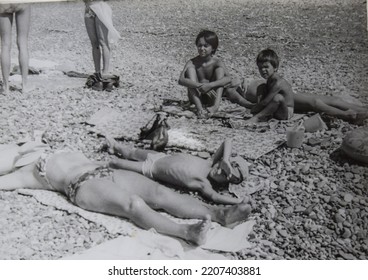 USSR, SOCHI - CIRCA 1979: Vintage Family Photo Of Mother With Children On The Black Sea Beach