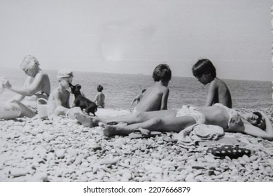 USSR, SOCHI - CIRCA 1979: Vintage Family Photo Of Mother With Children On The Black Sea Beach