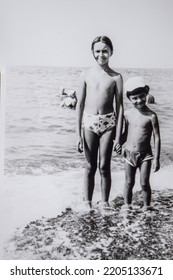 USSR, SOCHI - CIRCA 1980: Vintage Family Photo Of Little Sister And Brother On The Black Sea Beach