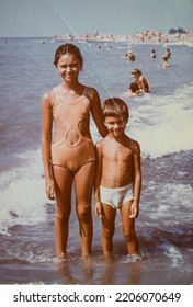 USSR, SOCHI - CIRCA 1981: Vintage Family Photo Of Little Sister And Brother On The Black Sea Beach