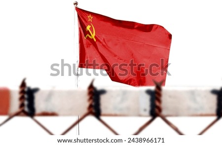 USSR. Soviet Union flag on cloudy sky. Depicts the symbol of the collapse of the Soviet Union. Step by step toward collapse. (The foreground is intentionally blurred) [[stock_photo]] © 