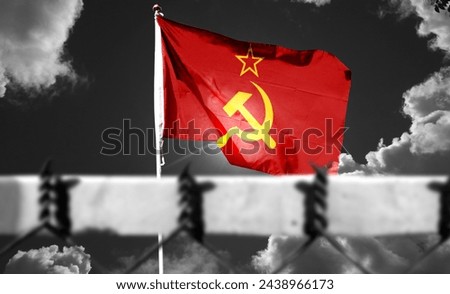 USSR. Soviet Union flag on cloudy sky. Depicts the symbol of the collapse of the Soviet Union. Step by step toward collapse. (The foreground is intentionally blurred) [[stock_photo]] © 