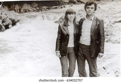 USSR, WESTERN UKRAINE, CARPATHIAN MOUNTAINS - CIRCA 1982: Vintage Family Photo Of Couple At Mountain Wild River