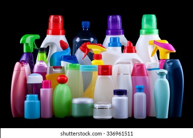 Usual plastic bottles from a household isolated on black - pollution and environment concept