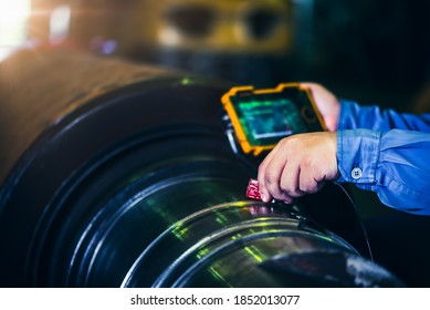 UT, Ultrasonic test to detect imperfection or defect in steel roller in the factory, NDT Inspection. - Shutterstock ID 1852013077
