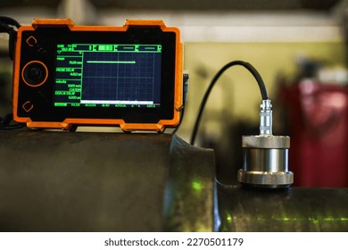 UT, Ultrasonic test to detect imperfection or defect in steel roller in the factory, NDT Inspection. - Shutterstock ID 2270501179