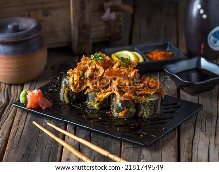 UTA sushi roll served in a cutting board isolated on wooden background side view of sushi roll Stock fotó © 