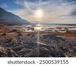 Utah Great Salt Lake Marsh During Sunset with Rocks and Plant Life. Background, Wallpaper, Cover.