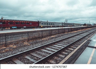 Utica, USA - December 29, 2018 - Vintage Trains And Train Tracks On Cloudy Day At Union Station In Utica, New York