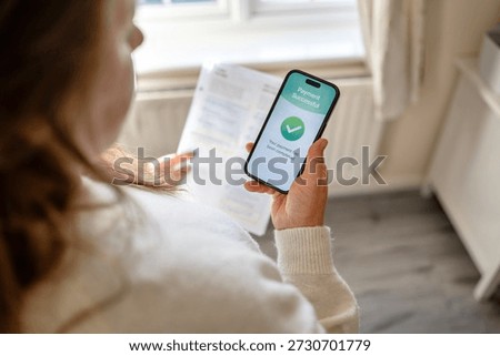 Utility bills paid successfully using mobile banking app. Household expenses and digital payment concept.
