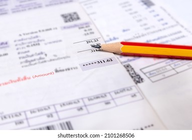 Utility energy bill with pencil blurred background, Bill and saving concept - Shutterstock ID 2101268506