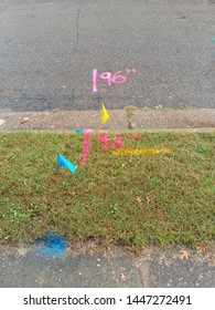 Utility Flags And Marks On A Boulevard And A Street.