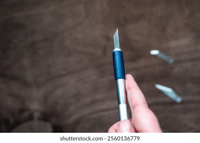 utility knife (also known as precision or exacto knife) with interchangeable blades used for crafting or modelmaking - Powered by Shutterstock