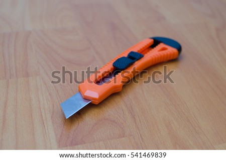 Utility knife on floor