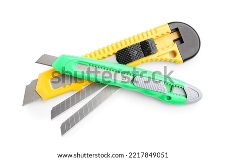 Utility knives with blades on white background
