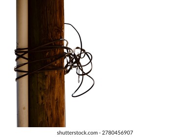 a utility pole with a cable twisted in a big knot isolated on white background 