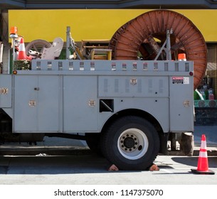 Utility Telecommunications Truck Parked On Urban Street.