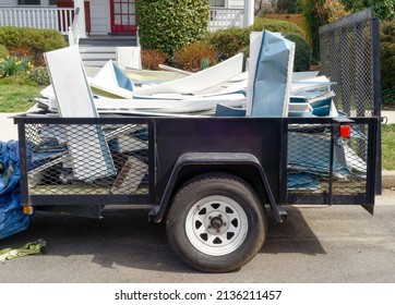 Utility Trailer Filled With Scrap Aluminum Siding.