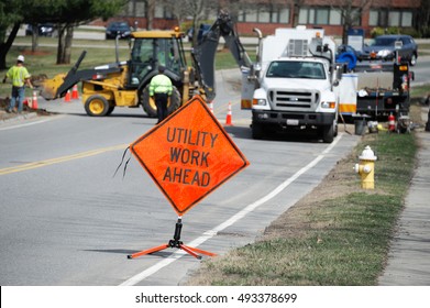 Utility Work And Warning Sign On The Street