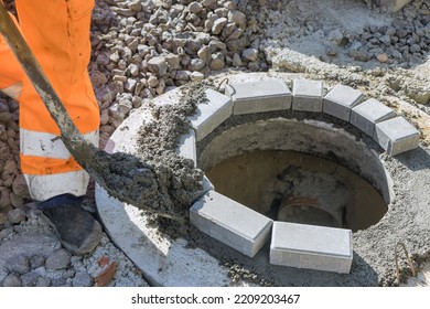 An Utility Worker Is Preparing For Construction Of Septic Sewer Manhole Sewage Reconstruction At Work Site