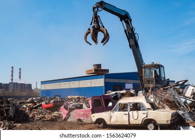 Utilization of the car. Old car at the dump of scrap metal. Utilization of the car at the dump. - Powered by Shutterstock