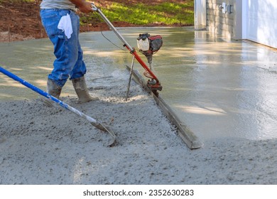 Utilizing tamping machine to align compacted concrete on new driveways