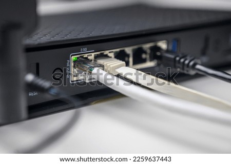 utp network cables connected in network switch on white table