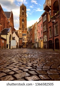 Utrecht Dom Church Tower With Cobbled  Street From A Low Perspective