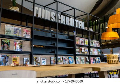 Utrecht, Holland - 14 June 2020: Magazine Rack With The Dutch Word For Magazine On Top, At The City Library. Reading Table In The Front