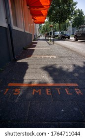 Utrecht, Holland, 24 Jun, 2020: Social Distancing Marks On The Sidewalk Near A Daycare Center