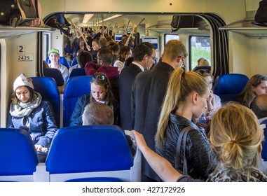 Utrecht, Holland, May 21, 2015; Overcrowded Passenger Train During Rush Hour With Most People Standing In The Aisle