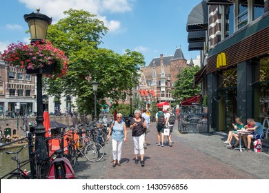 Utrecht, The Netherlands - July 05, 2018: Two Women Walking Downtown Dutch City Utrecht In Shopping Street Along City Canal