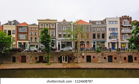 UTRECHT, THE NETHERLANDS, JUNE 2, 2018, canal with typical dutch houses on a split-level embankment, with warehosues in the cellar, coming out on an old ship wharf at water level, Utrecht, 2 Juni 2018