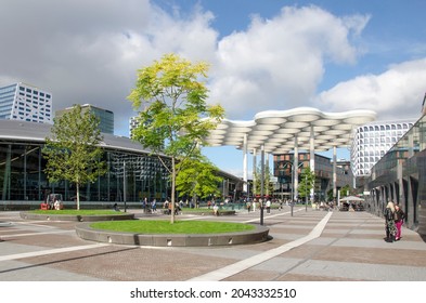 Utrecht, The Netherlands, September 16, 2021: the new station square with the central railway station and the iconic roof construction